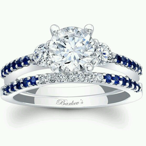 18CT WG RING WITH RB CUT DIAMOND AS CENTRE STONE AND ROUND BLUE SAPHIRES AND RB DIAMONDS IN BAND